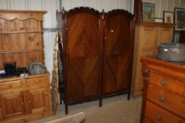 A mahogany two door wardrobe