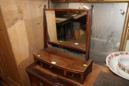 A 19th Century mahogany swing framed mirror raised