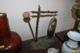 A brass gong and ink well