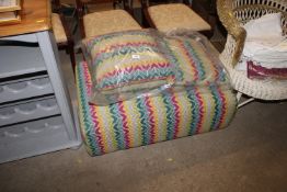 An Aztec design footstool and matching cushions