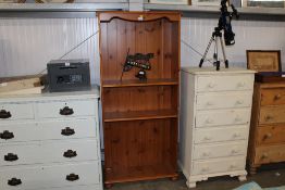 A pine open fronted bookcase
