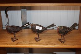 Three reproduction tin plate robins (48)