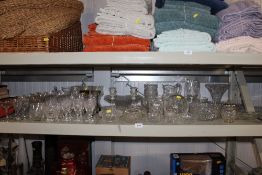 A quantity of table glass ware to include vases; B