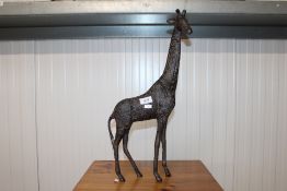 A reproduction ornament in the form of a giraffe