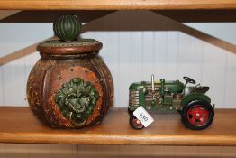 A model of a tractor together with an Italian leather covered glass dish with lid