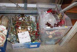 Two boxes containing various Christmas decorations