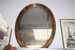 A gilt framed wall mirror
