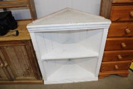 A white painted corner cabinet