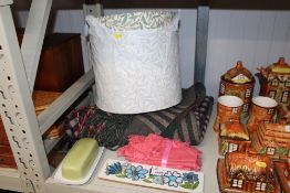 A lampshade; blankets and coat hooks etc.