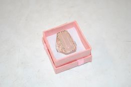 A large sterling silver and rose quartz dress ring