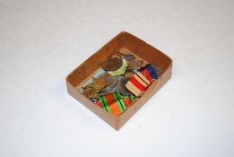 A box containing mainly WWII medals