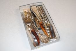A box containing various silver plated cutlery to