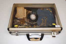 A case containing various costume jewellery includ