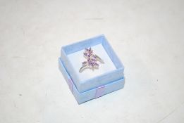 A sterling silver dress ring with cut amethyst