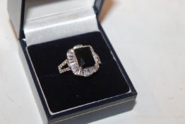 A 925 silver ring set with blue stone