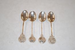 Four silver lawn bowls related spoons, approx. 59g