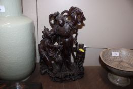 A Chinese carved hardwood figure group