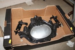 A box containing a pair of door handles and a cast