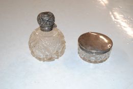 A cut glass and silver topped dressing table jar a