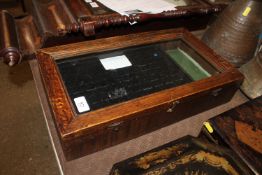 A glazed oak two layer table topped display case