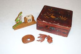 An Oriental lacquered box and contents to include