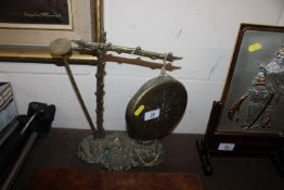 A brass gong and ink well