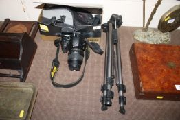 A Nikon D5100 camera with original box, lens and carry ba