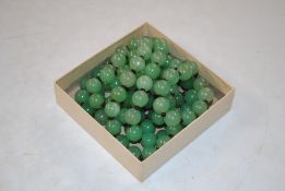 A jade coloured bead necklace