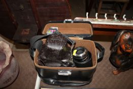 An Olympus OM-2 camera in fitted case with various