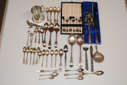 A box containing three silver teaspoons; a silver