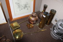 A pair of brass shell cases, two chestnut roasters