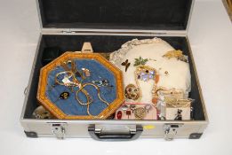 A case containing various costume jewellery includ