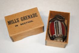 A boxed Mills grenade in section