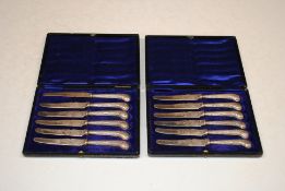 Two cased sets of six silver handled knives