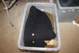 A box of various military style uniforms