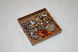 A white metal charm bracelet with various charms a