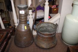 An antique copper cauldron and an eastern copper e