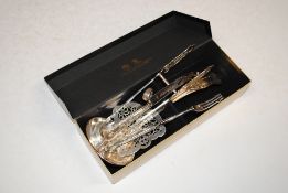 A box containing asparagus servers; an Arthur Pric