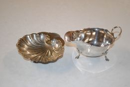 A silver sauce boat approx. 90.5gm and a silver pl
