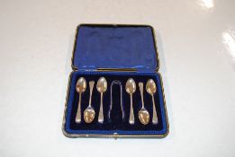 A cased set of six silver spoons and sugar tongs