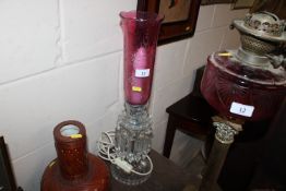 A modern glass table lamp in the form of a lustre