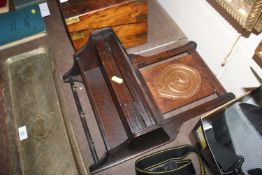 An oak hanging cupboard of small proportions with