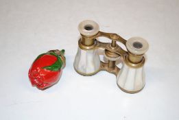 A pair of mother of pearl opera glasses and a Limo
