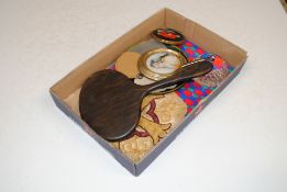 A box containing compacts, dressing table hand mir
