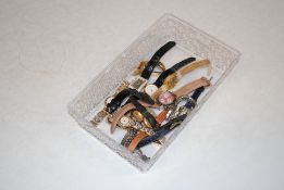 A box of ladies wrist watches including Bulova and Swatch