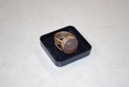 A vintage white metal ring set with a coloured sto