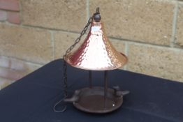 Copper roofed bird feeder. V
