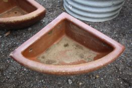 A quarter glazed stoneware horse feed bowl