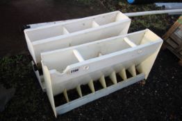 2x plastic pig feeders.