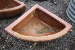 A quarter glazed stoneware horse feed bowl